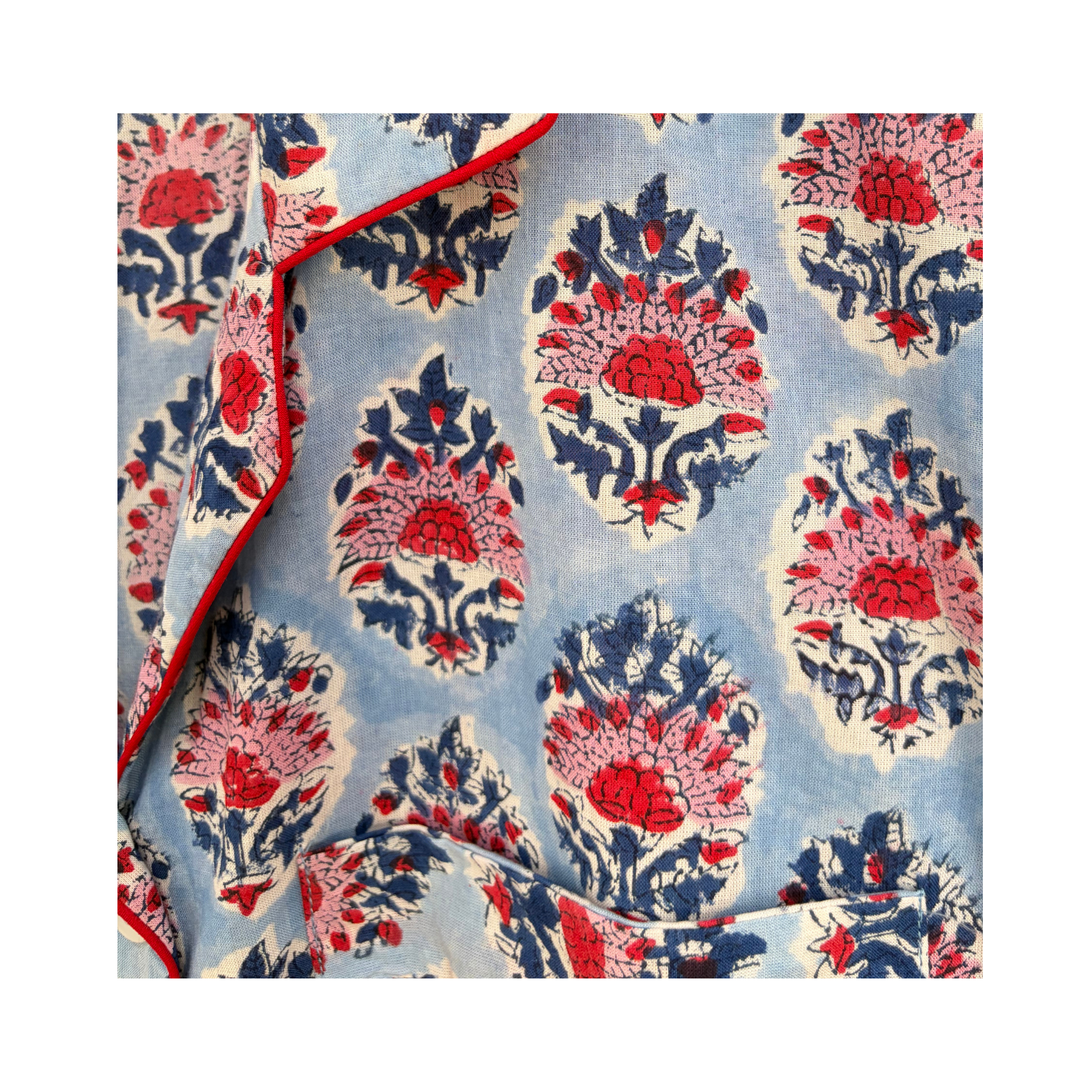 Pajama Crush gift-ready pouch in Riviera Blue block print cotton, filled with pajama set