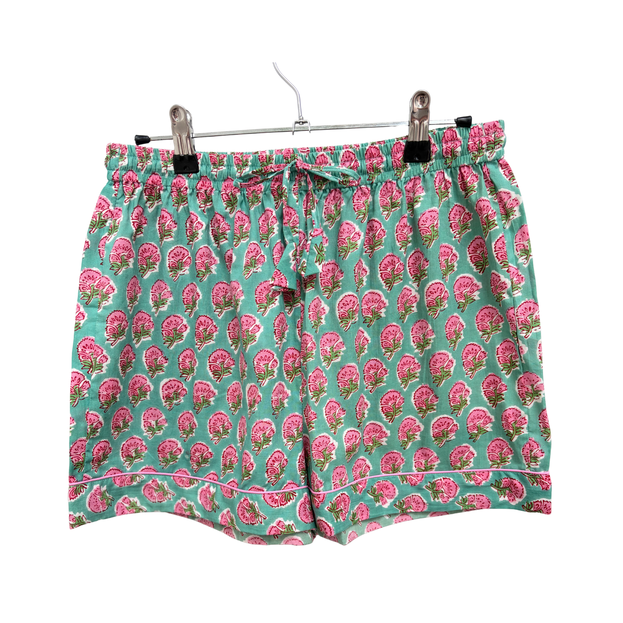 Pajama Crush gift-ready pouch in Pink Lagoon block print cotton, filled with pajama set