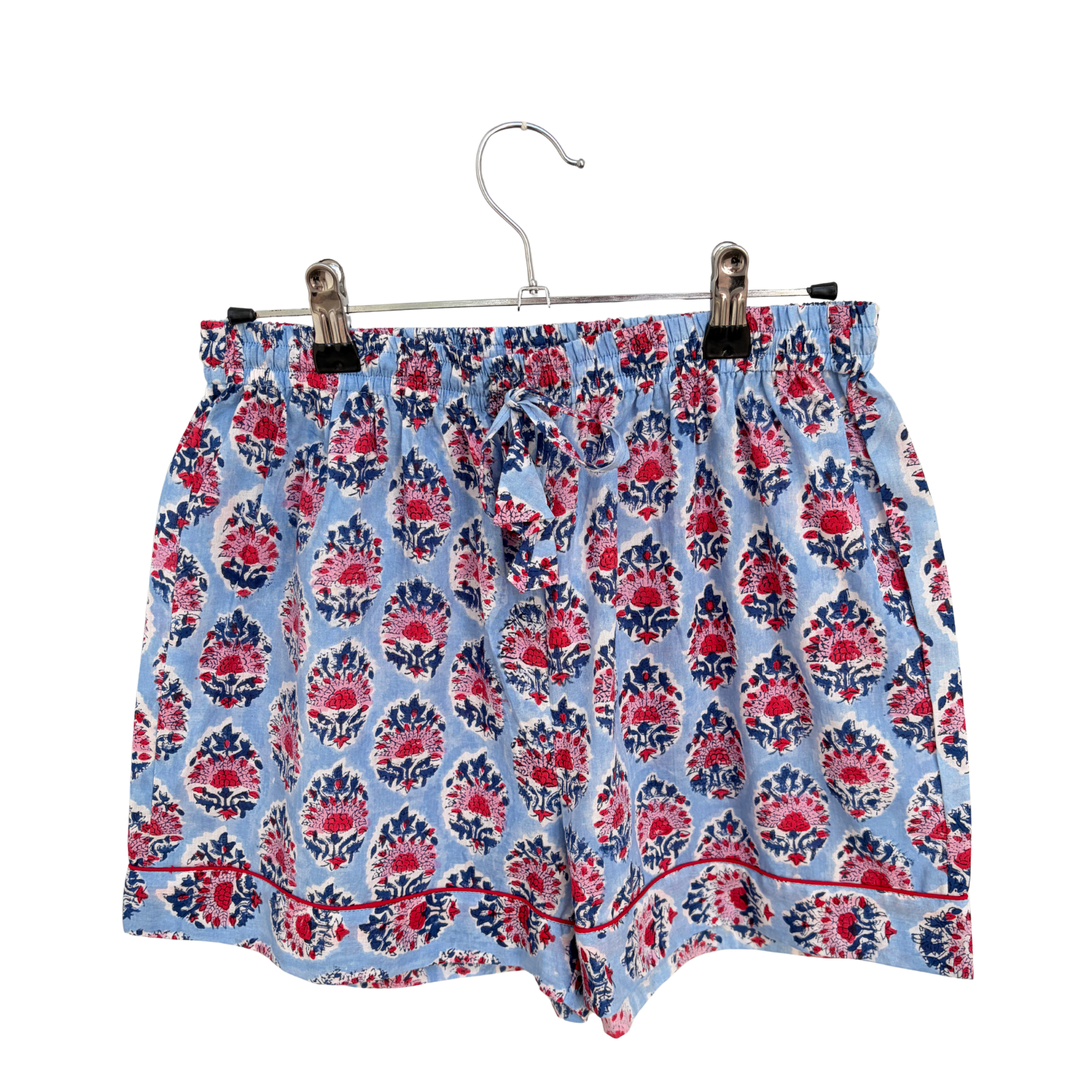 Pajama Crush gift-ready pouch in Riviera Blue block print cotton, filled with pajama set